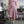 Load image into Gallery viewer, Woman standing in fashion studio wearing a mauve skirt and matching top. Paired with a neck scarf, shoulder bag and sneakers. The skirt has a crossover waistband and fits to the knees.
